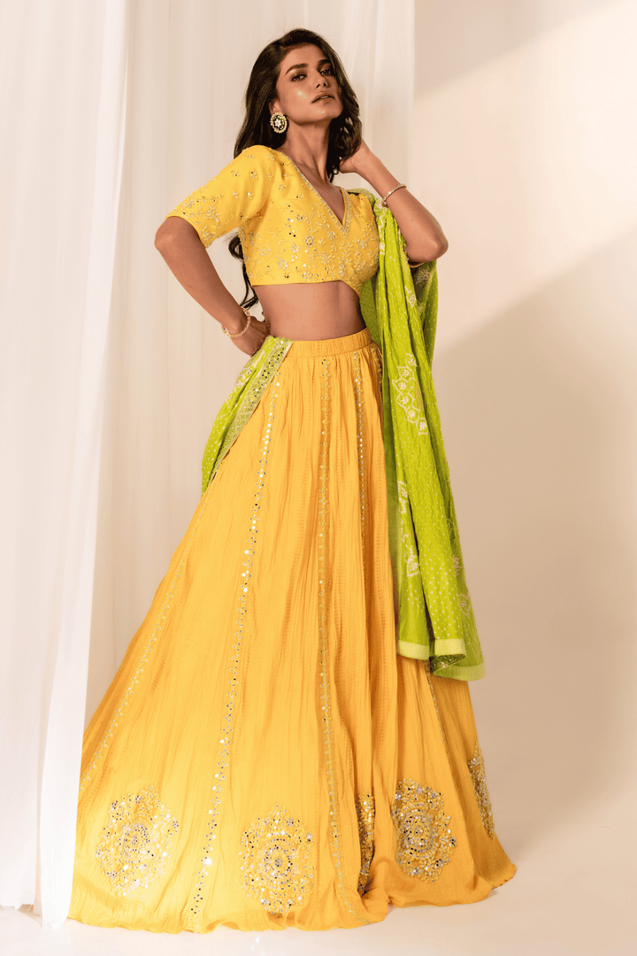 Lemon mirror work blouse with crush skirt and green Bandhani dupatta