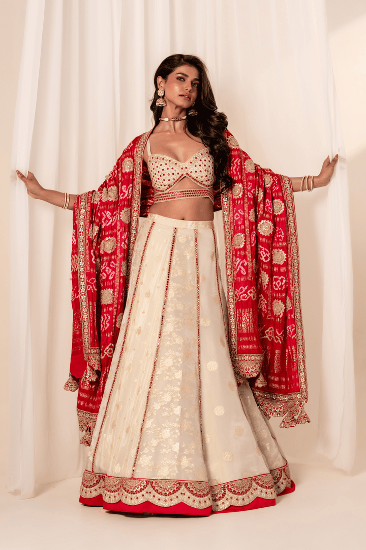 Off-white Banarasi lehenga with gotapatti blouse and Bandhani dupatta