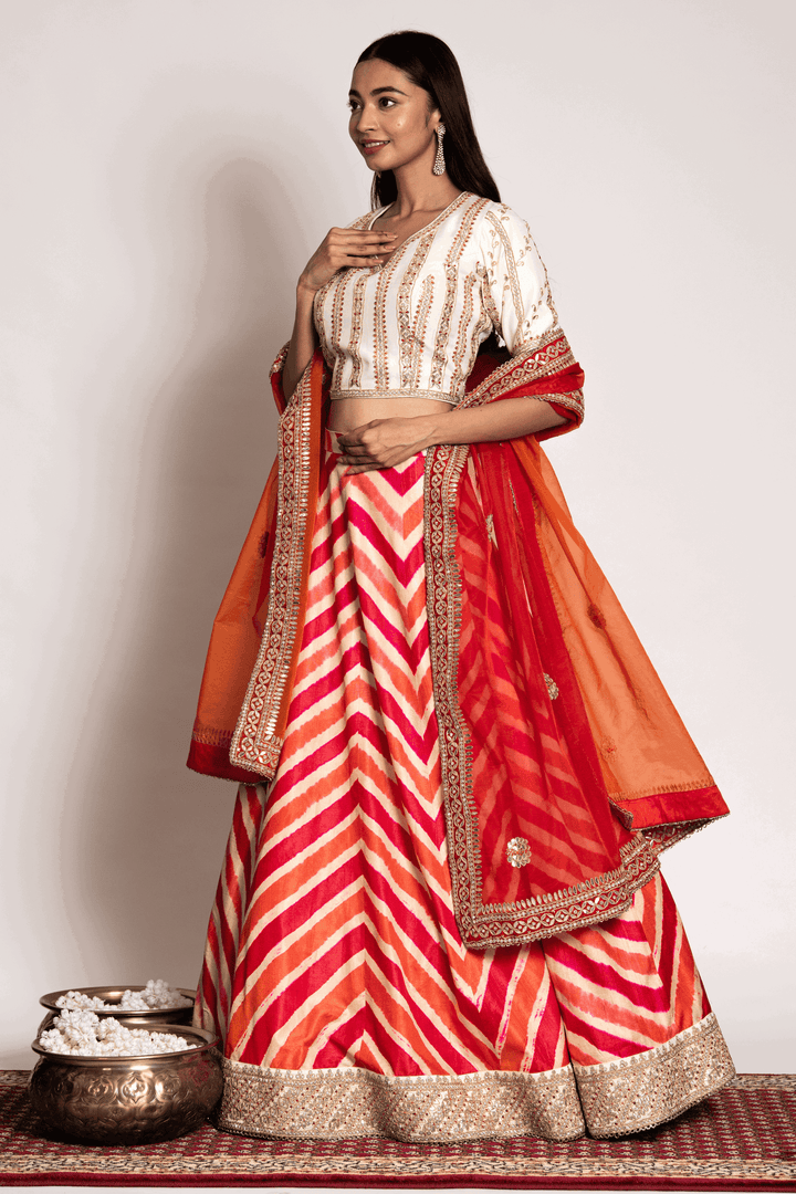 Off White Gota Blouse Paired With Rust Leheriya Skirt And Organza Dupatta - Bandhani