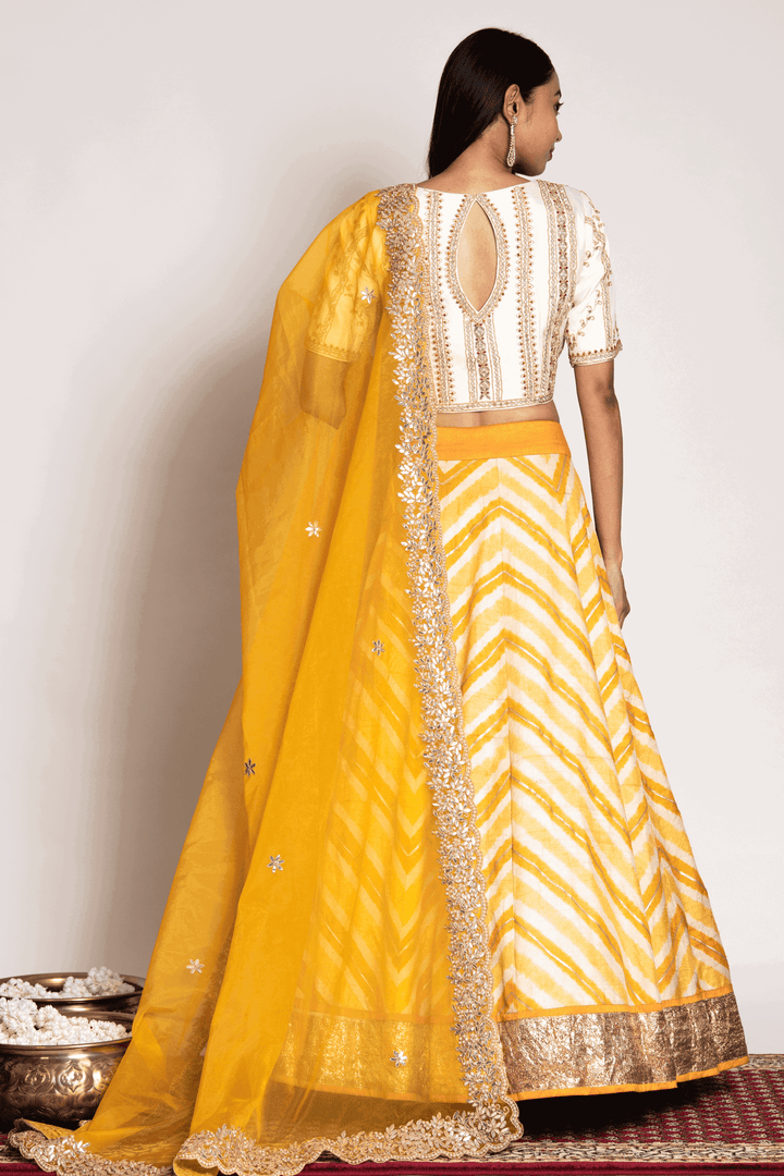 Off White Gota Blouse Paired With Yellow Leheriya Skirt And Organza Dupatta - Bandhani
