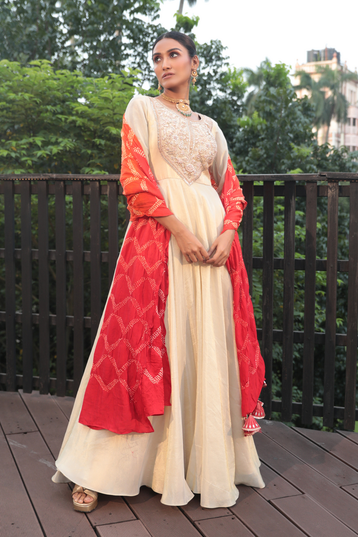 Offwhite Tissue Gotapatti Anarkali With Orange Bandhani Dupatta Offwhite Tissue Gotapatti Anarkali With Orange Bandhani Dupatta