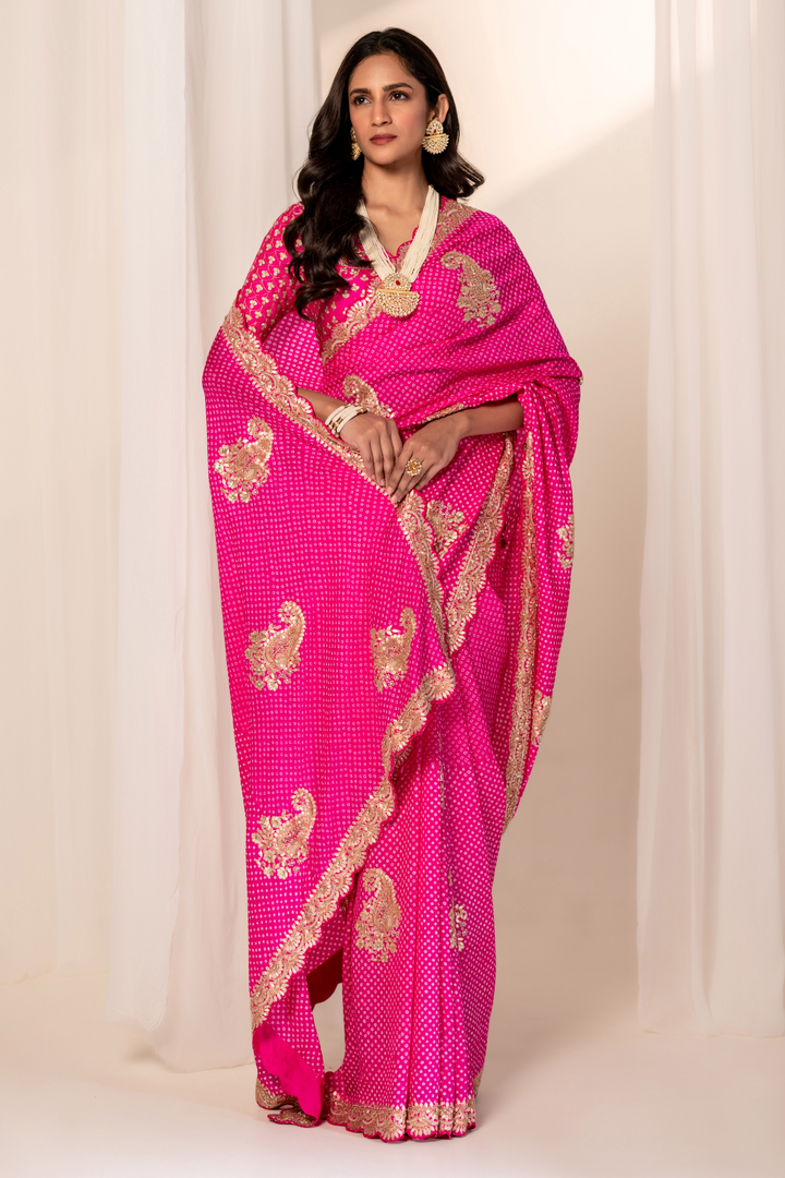 Pink Bandhani saree styled with traditional jewelry