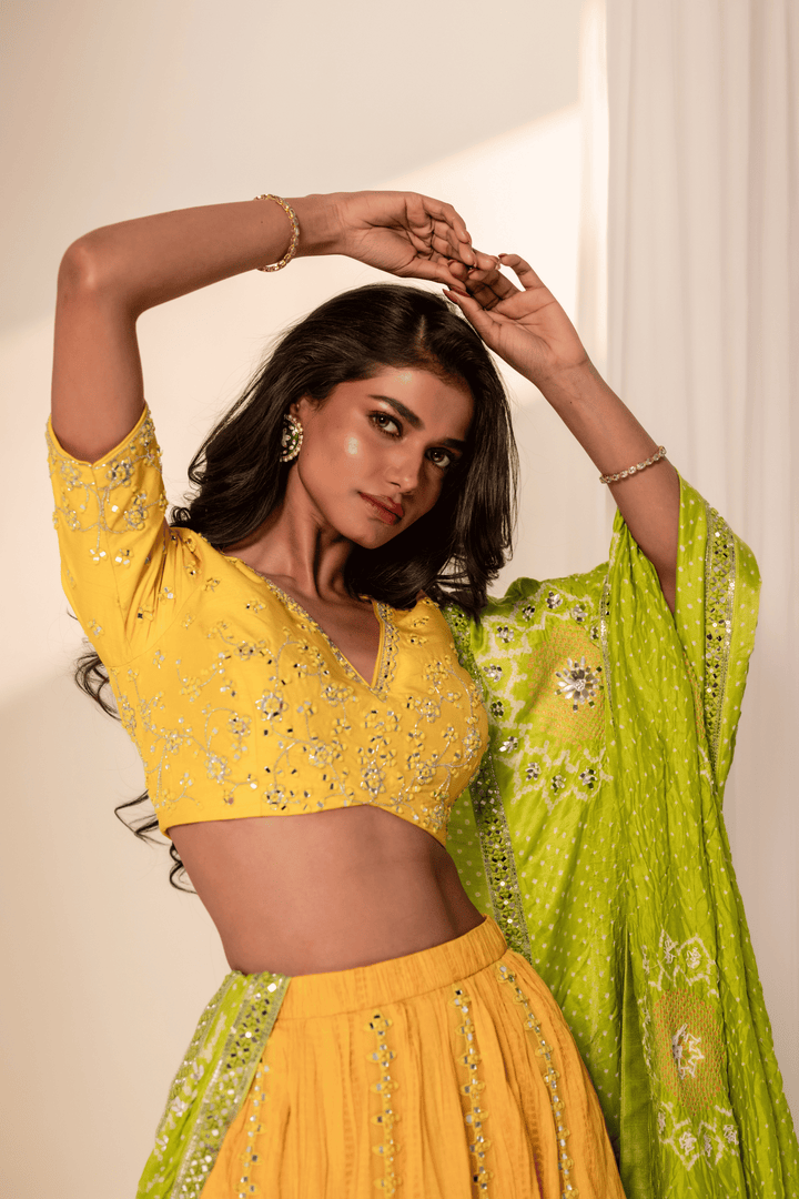 Yellow crush silk lehenga with green Bandhani gazzi silk dupatta