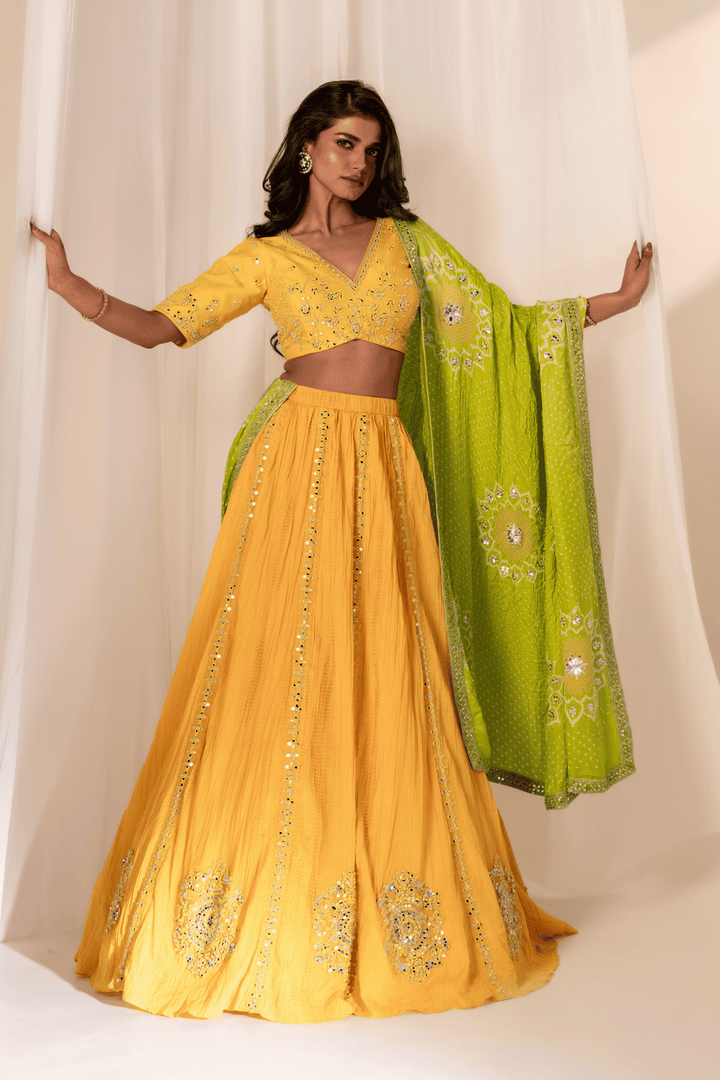 Lemon mirror work blouse with crush skirt and green Bandhani dupatta