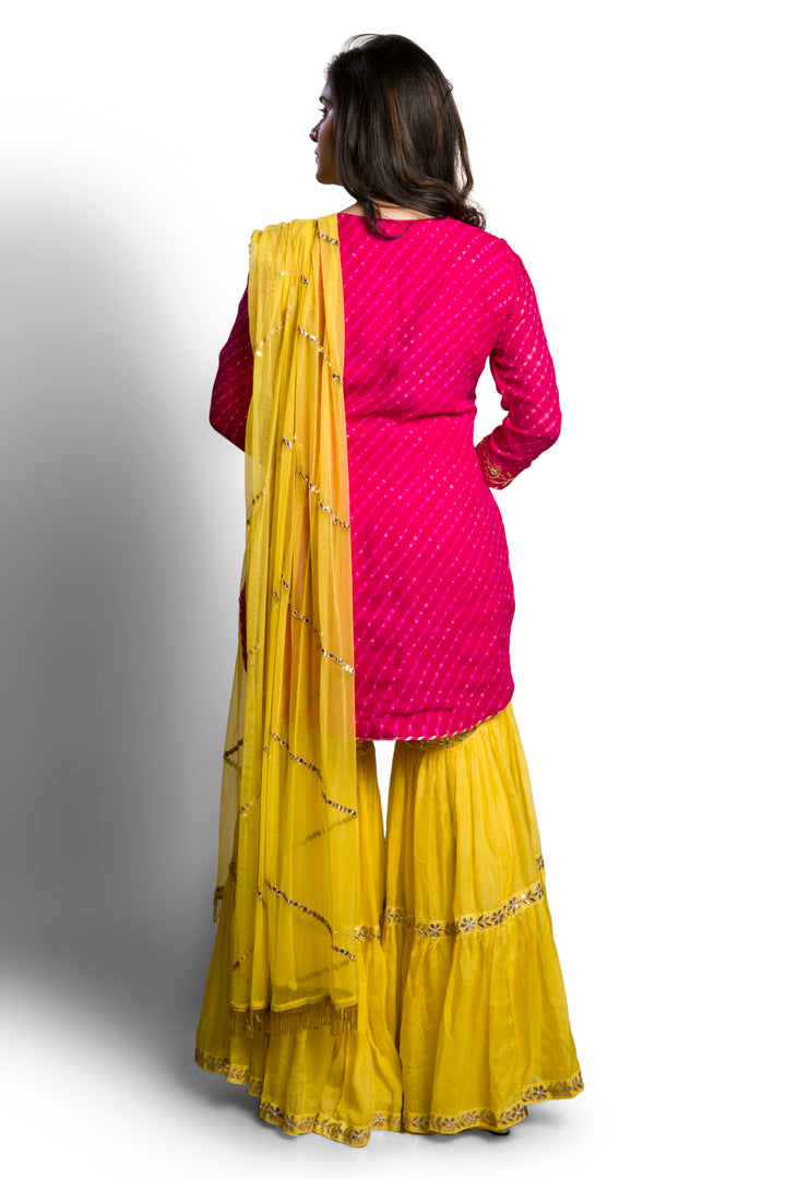 yellow pallazo with pink leheriya suit